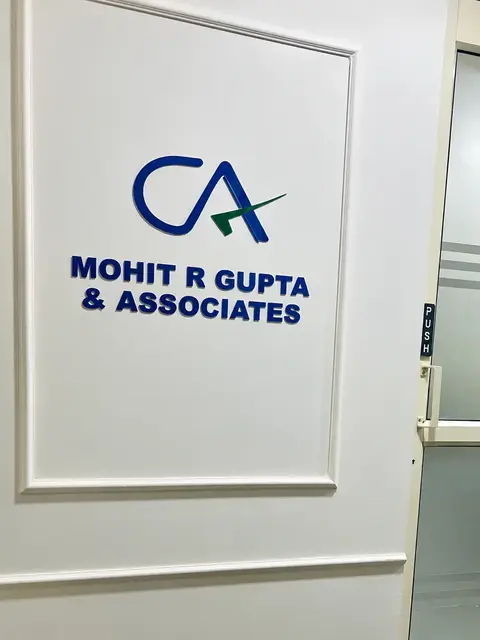 CA emblem and Mohit R Gupta & Associates sign inside the office