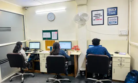 Team members working at desks in the Krishna Nagar office